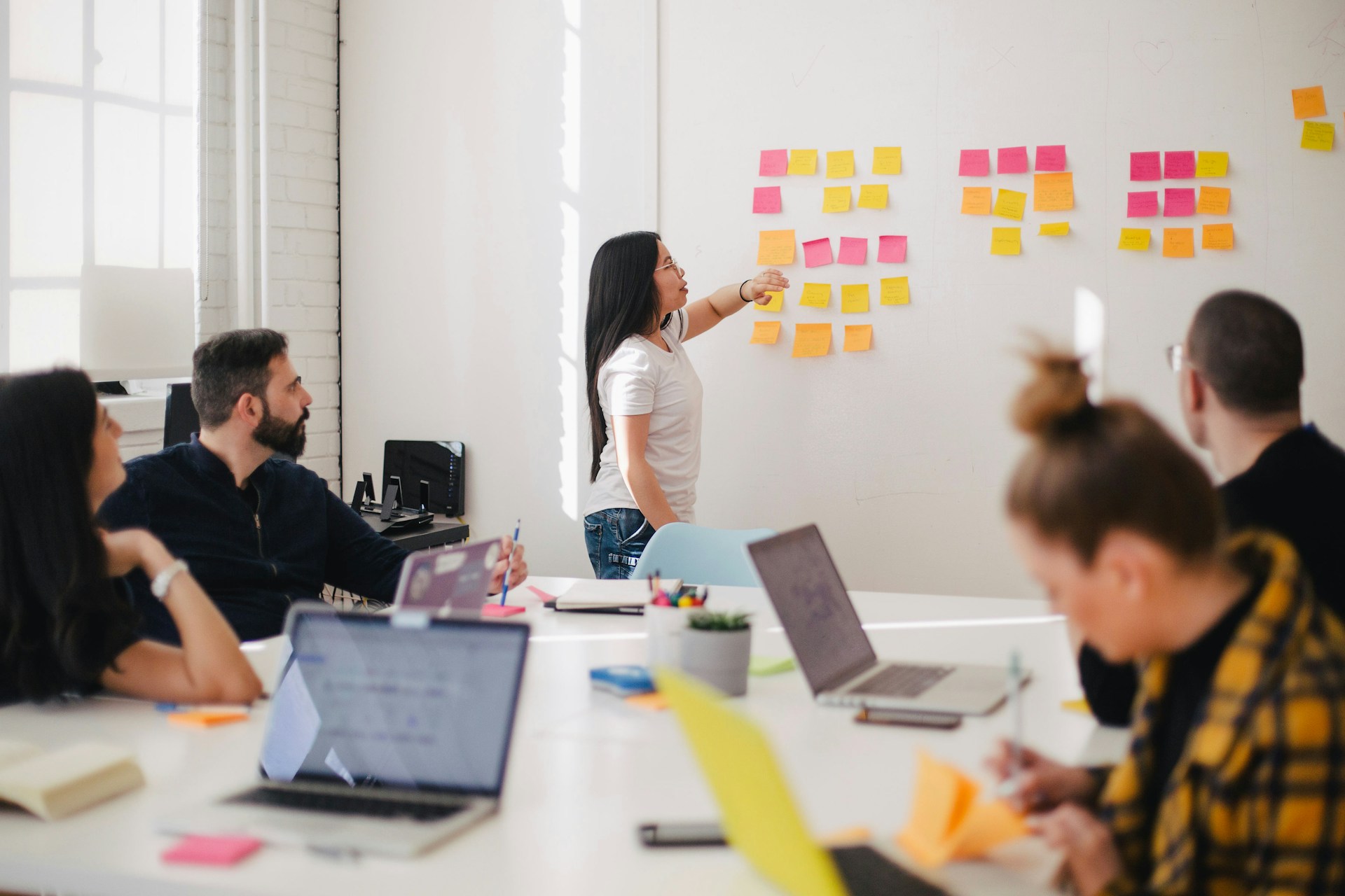 Content strategist reviewing AI-generated draft on a large monitor